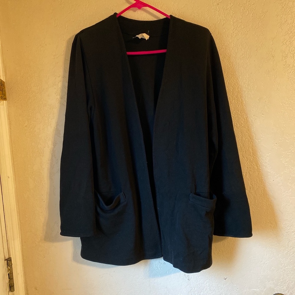 Women’s black cardigan.